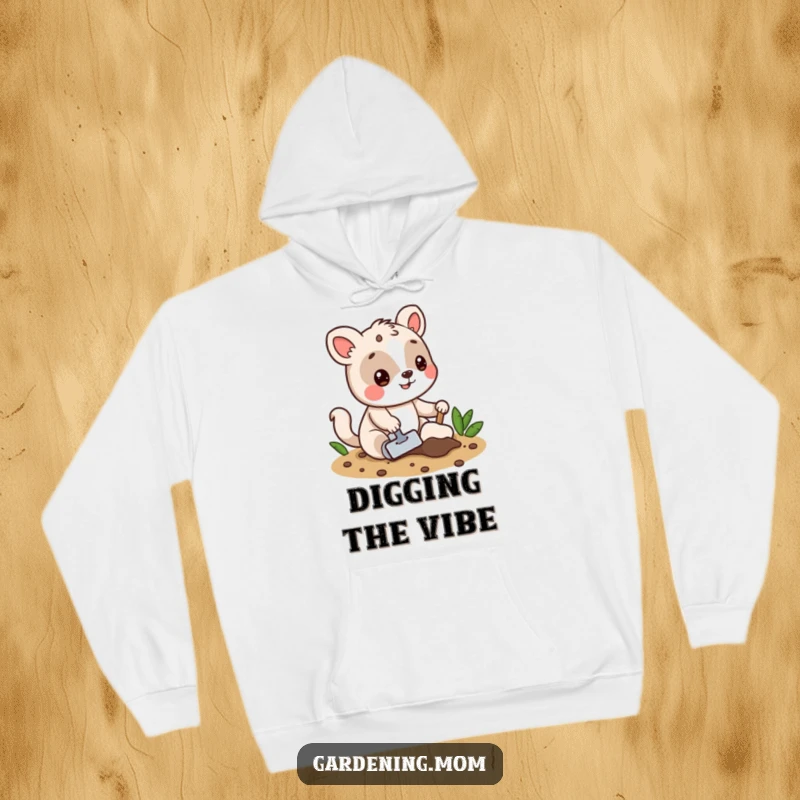 Funny hoodie depicting a playful animal digging into the soil with a trowel, offering warmth and garden-themed humor.